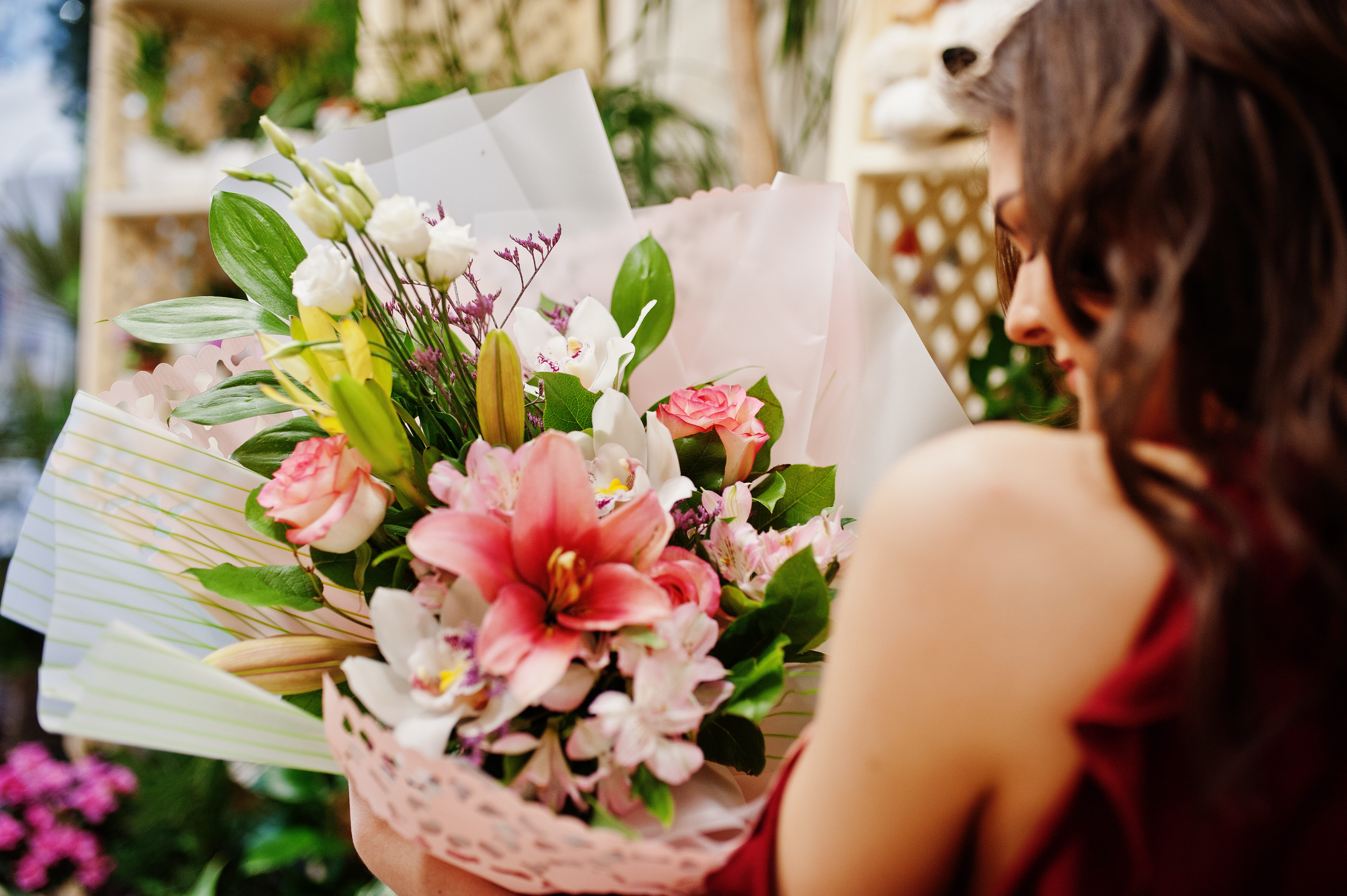 brunette-girl-red-buy-flowers-flower-store